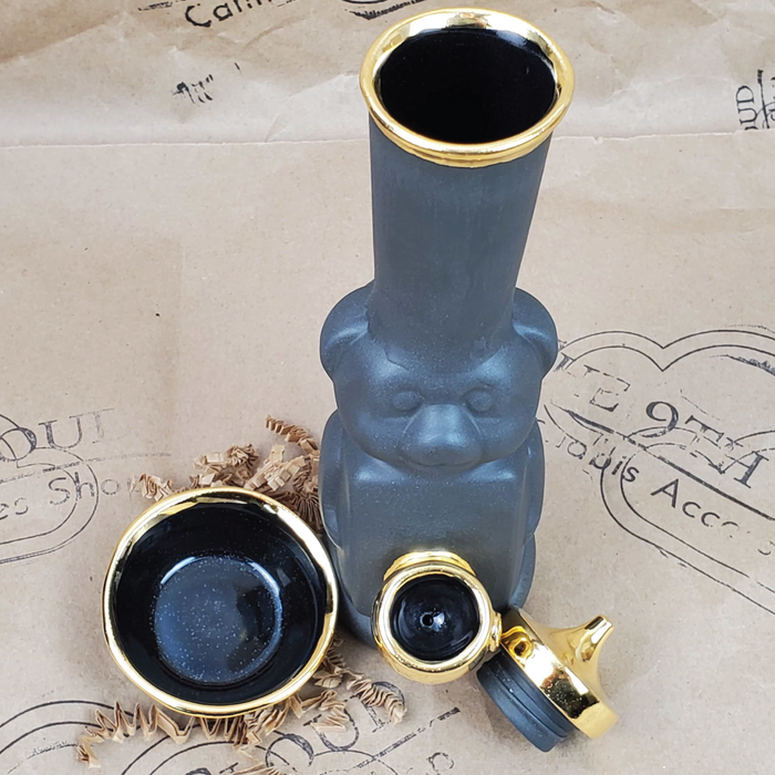 HONEY BEAR BUBBLER BONG WITH BOWL IN MATTE BLACK AND GOLD WITH THE 9TH CLOUD CANNABIS ACCESSORIES SHOP LOGO BACKGROUND