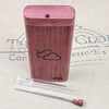 PURPLE HEART WOOD DUGOUT WITH THE 9TH CLOUD LOGO WITH GLASS PIPE ON THE 9TH CLOUD CANNABIS ACCESSORIES LOGO BACKGROUND