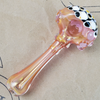 GLASS PIPE WITH YELLOW STARBURST DESIGN ON THE 9TH CLOUD CANNABIS ACCESSORIES SHOP LOGO BACKGROUND