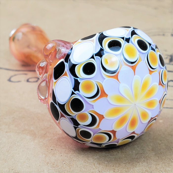 GLASS PIPE WITH YELLOW STARBURST DESIGN ON THE 9TH CLOUD CANNABIS ACCESSORIES SHOP LOGO BACKGROUND