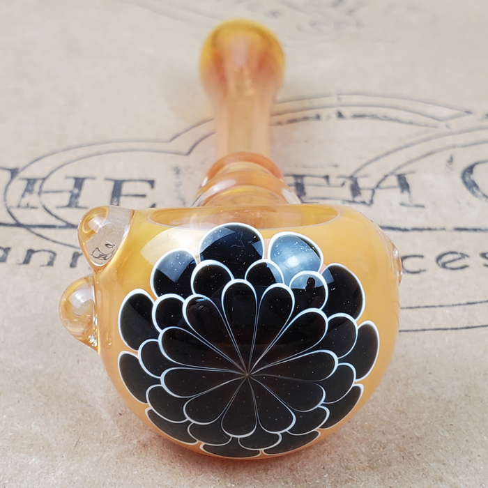 GLASS PIPE WITH BLACK  FLOWER PEDAL DESIGN ON THE 9TH CLOUD CANNABIS ACCESSORIES SHOP LOGO BACKGROUND