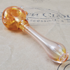 GLASS PIPE WITH TEAL FLOWER PEDAL DESIGN ON THE 9TH CLOUD CANNABIS ACCESSORIES SHOP LOGO BACKGROUND