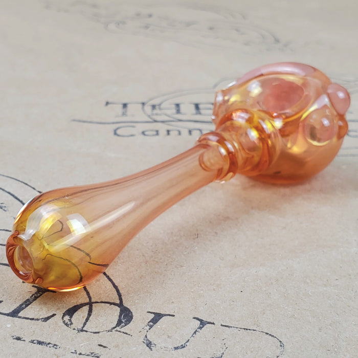 GLASS PIPE WITH PINK FLOWER PEDAL DESIGN ON THE 9TH CLOUD CANNABIS ACCESSORIES SHOP LOGO BACKGROUND
