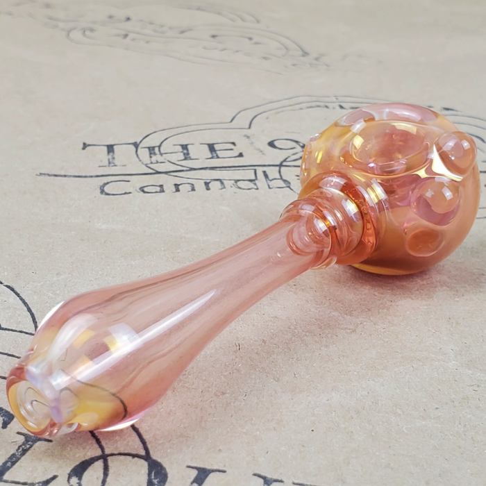 GLASS PIPE WITH PURPLE FLOWER PEDAL DESIGN ON THE 9TH CLOUD CANNABIS ACCESSORIES SHOP LOGO BACKGROUND