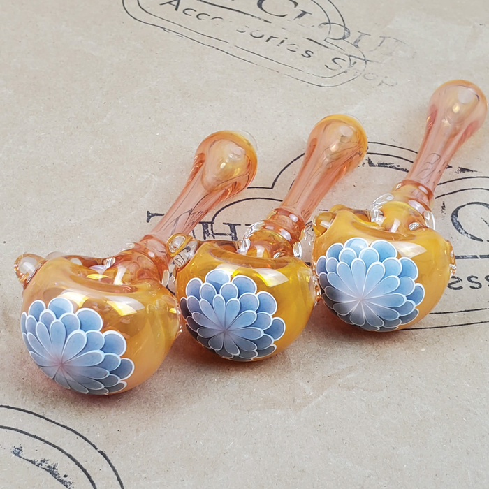 GLASS PIPE WITH GREY BLUE  FLOWER PEDAL DESIGN ON THE 9TH CLOUD CANNABIS ACCESSORIES SHOP LOGO BACKGROUND
